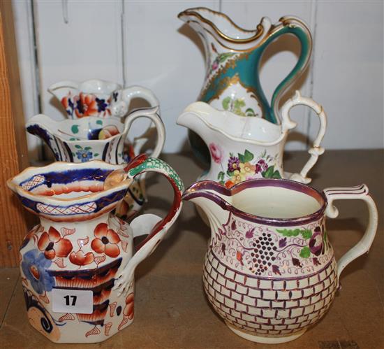 6 variously decorated jugs(-)